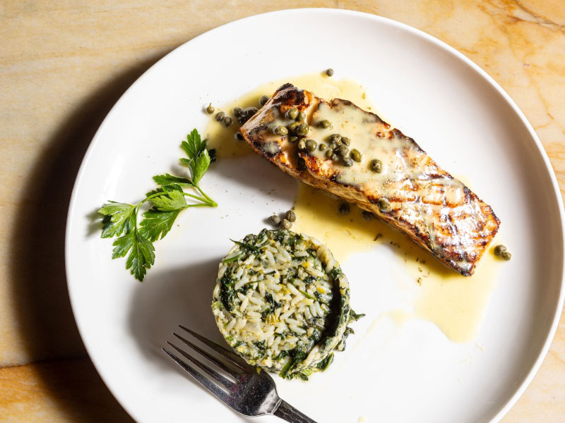 Grilled salmon with ladolemano, capers and spanakorizo